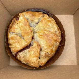 a pie in a cardboard box
