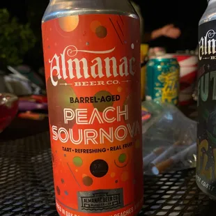 two cans of beer on a table