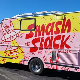 a food truck with graffiti on it