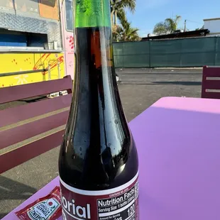 a bottle of soda on a table