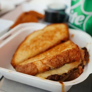 a sandwich in a styrofoam container