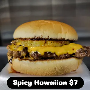 Onion infused smash patty,  American cheese,  Seared pineapple and hot honey.