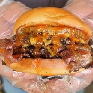 Big Kahuna- Double French Onion smash patties,  American cheese,  Bacon, Seared pineapple, Lettuce, and hot honey.