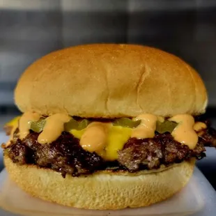 $7 Classic Smash. French onion infused smash patty,  American cheese, pickles, and burger sauce.