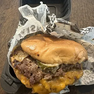 "The four the merrier" (four meat patties, onions, jalapeños, cheese and spread)