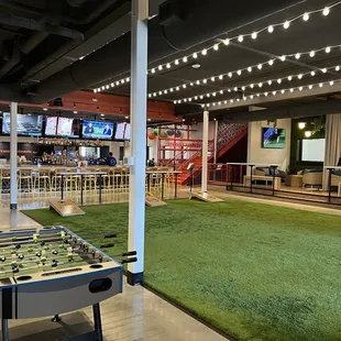 Indoor cornhole, bar and cabanas