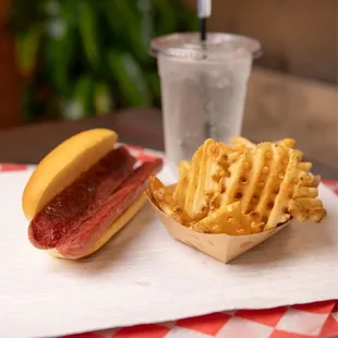 a hot dog and waffle fries
