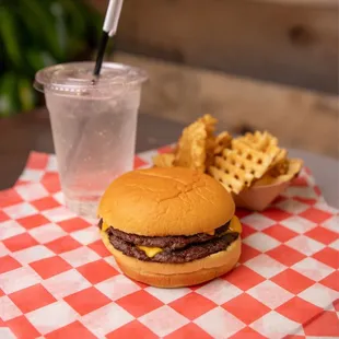 a burger and chips on a table