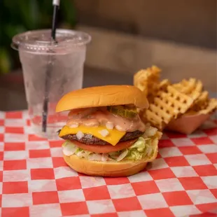a cheeseburger and waffle fries