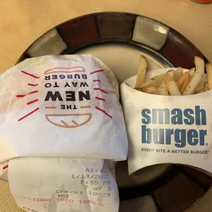 a plate of french fries and a bag of chips