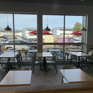 empty tables and chairs in a restaurant
