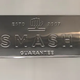 a close up of a metal sign