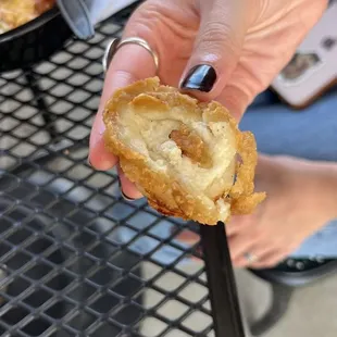 The uncooked ONION RINGS where the batter is visible