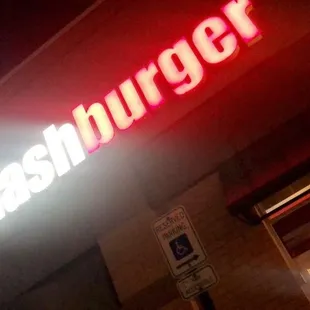 a neon sign for a fast food restaurant