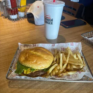 a hamburger and fries on a tray