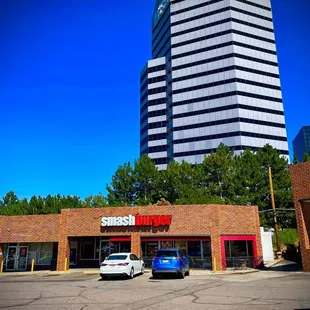 two cars parked in front of a building