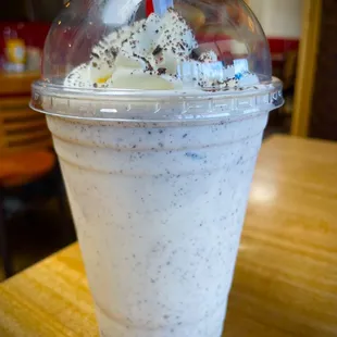 a milkshake in a plastic cup