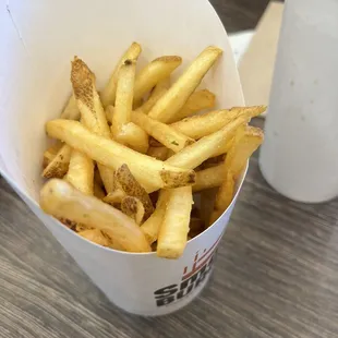french fries in a paper container