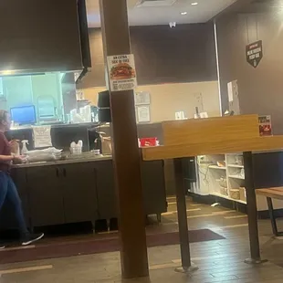 Chicken in her hand while customer is waiting