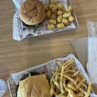 two baskets of fries and a hamburger