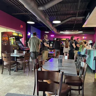 Dining area with consoles in the background