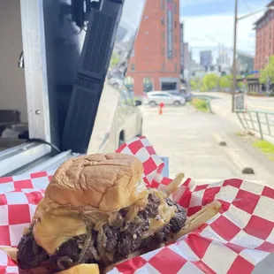  hamburger and fries in a basket