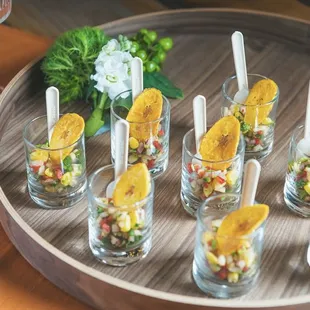 Veggie Ceviche Cup
With corn, apple, red onion, jalapeño, bell pepper and cilantro topped with a plantain crisp
(Vegan and Gluten Free)