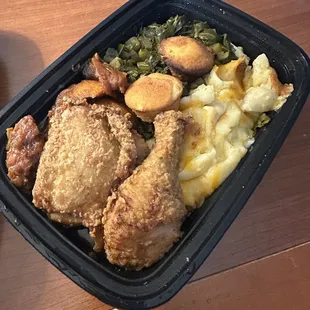 Down South Cuisine  Buttermilk fried chicken (dark meat), served w/ creamy mac &amp; cheese, collard greens, candied yams &amp; cornbread