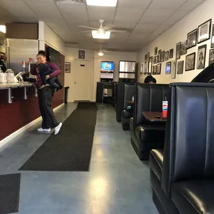 a woman standing in a diner