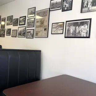 a wall of black and white photographs