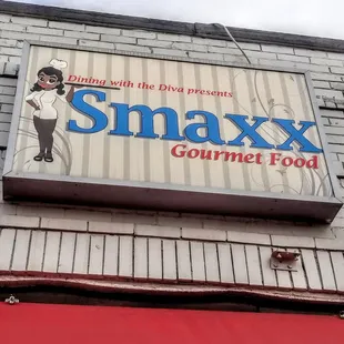 a sign for a gourmet food restaurant