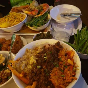 Crab/shrimp/steak piled creole fries, fried shrimp, chicken tenders, garlic green beans, and homie got a rib eye with platter