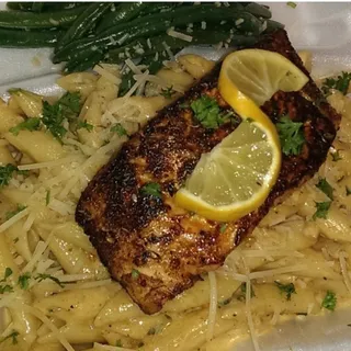 Blackened salmon over garlic noodles