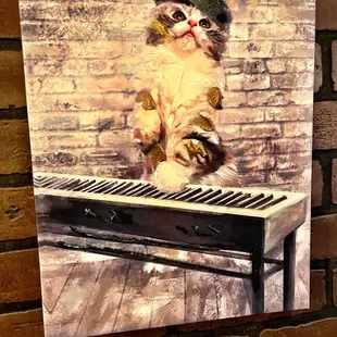 a cat sitting on a piano