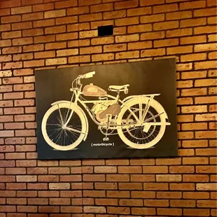 a motorcycle on a brick wall