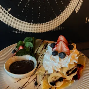 Sweet crepes with fruits and chocolate