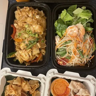 a variety of asian food in plastic containers