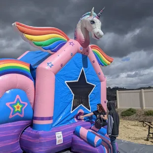 The Glitter Unicorn Bounce House Rental with Double Lane Slide