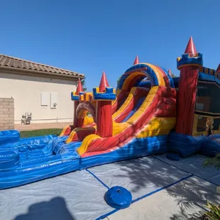 The Fortress Bounce House Rental with Double Lane Water Slide