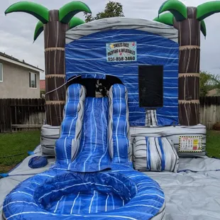 The Tropical Paradise Bounce House Rental with Slide
