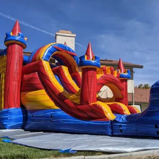 The Fortress Bounce House Rental with Double Lane Slide