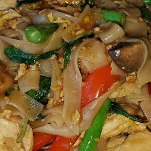 Drunken Noodle $12.95 Wide rice noodle sauteed, green bean, onions, bell peppers, mushroom, basil, egg in homemade chili sauce and basil