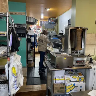 a woman working in a kitchen