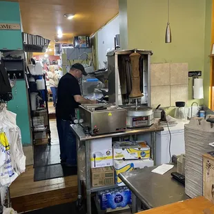 a man preparing food in the kitchen