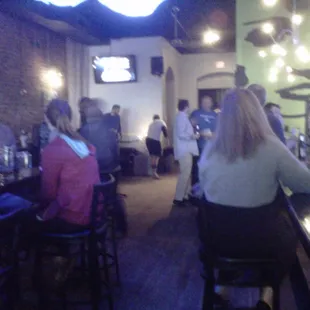 people sitting at a bar