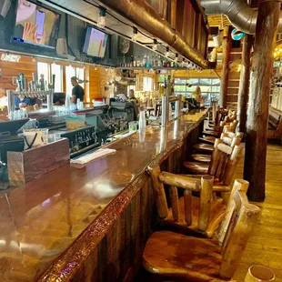 Large Bar with all Wooden Tables and Chairs