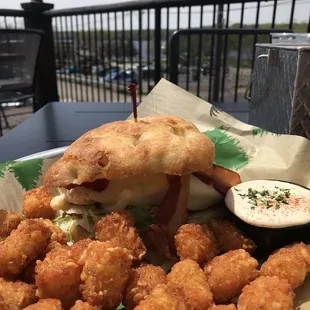 Chicken Club &amp; tots with seasoned sour cream.