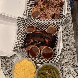 Brisket, pulled pork, green beans, Mac n cheese (we devoured the egg rolls)