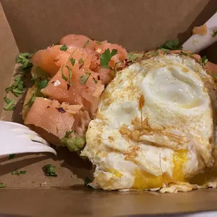 Avocado toast with smoked salmon and optional egg.