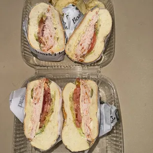 two sandwiches in plastic containers